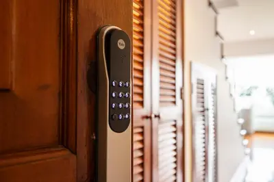 a close up of a remote control on a door at Luxury Duplex Stunning Golf Views - Prime Location in Lima