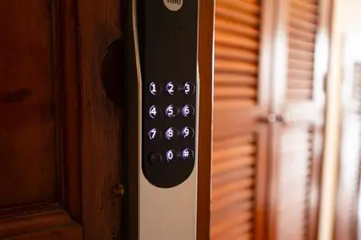 a close up of a remote control on a wall at Luxury Duplex Stunning Golf Views - Prime Location in Lima