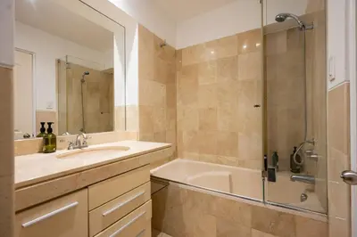 a bathroom with a tub and a sink and a shower at Luxury Duplex Stunning Golf Views - Prime Location in Lima