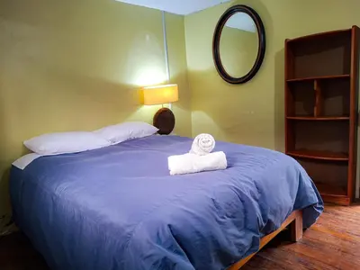 a bedroom with a bed with a towel on it at Casa Aguilar in Urubamba