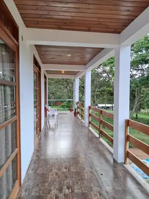 an empty porch of a house with a wooden ceiling at Bellavista Hospedaje in Oxapampa