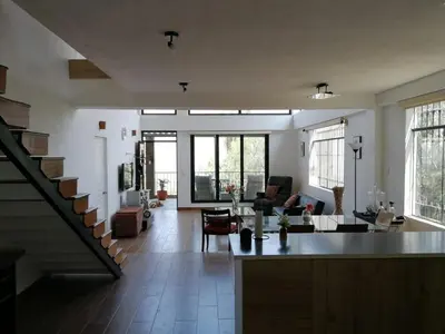 a large living room with a staircase and a living room at Nice country house with pool and beautiful view in Huarochirí