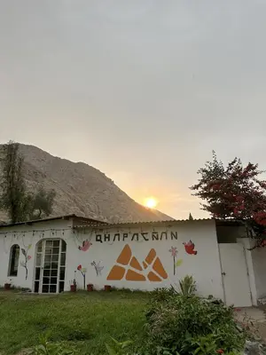 a building with a mural on the side of it at QPÑ Hoteles - Hacienda Nieve Nieve in Balconcillo de Aviyay