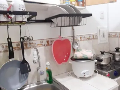 a kitchen counter with a sink and a mixer at Cómodo e independiente minidepartamento a pasos del Circuito Mágico in Lima