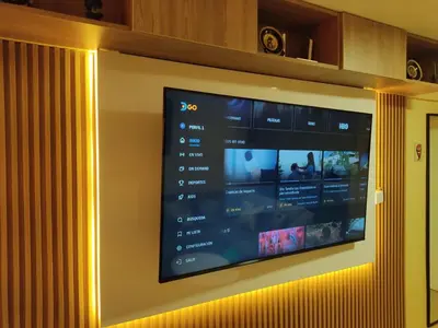 a flat screen tv hanging on a wall at Céntrico departamento in Lima