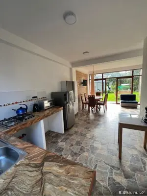 a kitchen with a sink and a stove top oven at Lofts Illawasi in Urubamba