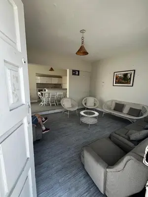 a living room with a couch and a table at Casa playa Punta Hermosa in Punta Hermosa
