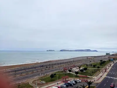 a view of the beach and a pier at Departamento Costa Verde San M in Lima