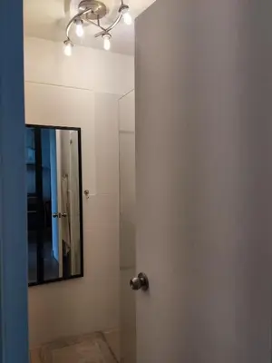 a bathroom with a mirror and a shower at Departamento Costa Verde San M in Lima