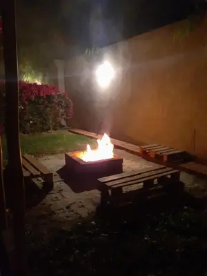 a fire pit in a yard at night with a street light at Villa Lunahuana in Lunahuaná