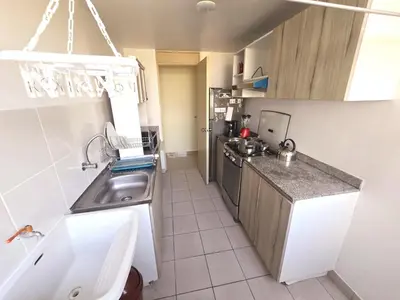 a small kitchen with a sink and a counter at Apartamento Premium frente a Universidad San Marcos para 4 pers en lima in Lima