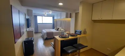 a small room with a bed and a television at Munay hospedaje in Cusco