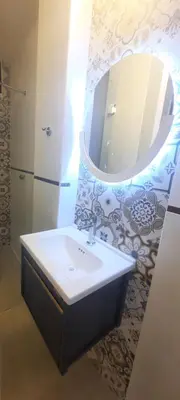a bathroom with a sink and a mirror at Munay hospedaje in Cusco