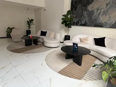 a living room with two tables and a couch at Art08 Milu - Miraflores Cerca de Larcomar in Lima