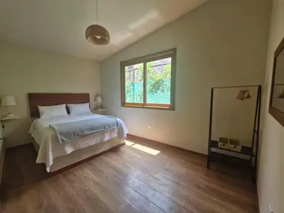 a bedroom with a bed and a window at Tornameza Casa de Campo in Torna Mesa