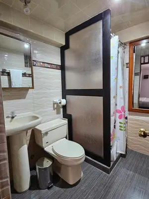 a bathroom with a toilet and a sink at SAMAY WASI b&b in Cusco