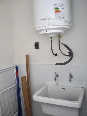 a bathroom with a toilet and a sink at Craviz house ,a home away from home in Lima