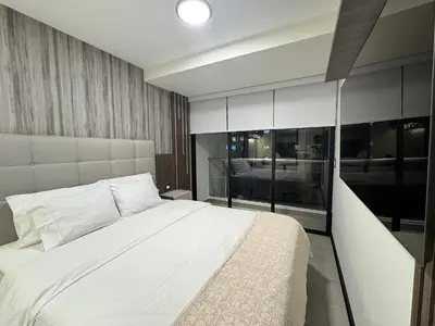 a bedroom with a white bed and a large window at San Isidro 1 Bedroom RN in Lima