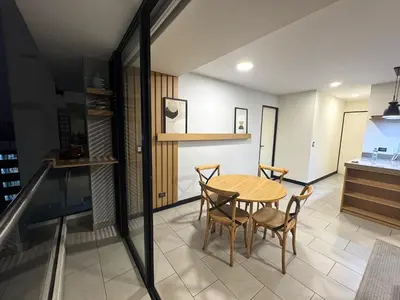 a kitchen and dining room with a table and chairs at San Isidro 1 Bedroom RN in Lima