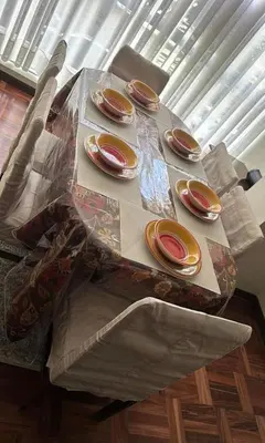 a table with four plates on top of it at Departamento centrico cusco in Cusco