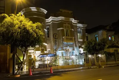 a building at night with orange cones in front of it at Casa Falleri Boutique Hotel in Lima