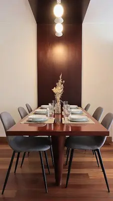 a large wooden table with chairs around it at Luxury apartment in Miraflores near Larcomar in Lima
