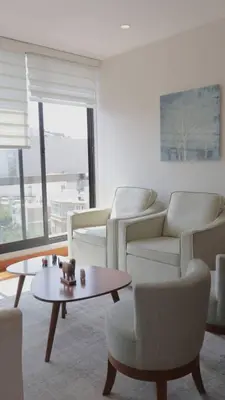 a living room with couches and a coffee table at Luxury apartment in Miraflores near Larcomar in Lima