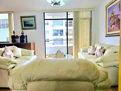 a living room with two couches and a window at E Malecon Balta Queen Bed Larcomar Zone 3B 501 in Lima