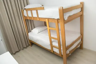a couple of bunk beds in a room at Luxurious Apt with Rooftop, BBQ, and Beach nearby in Punta Hermosa