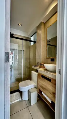 a bathroom with a toilet and a sink and a shower at Apartamentos Boho in Punta Hermosa