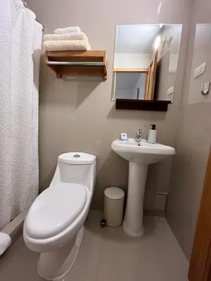 a bathroom with a toilet and a sink at Casa Terra Cusco in Cusco