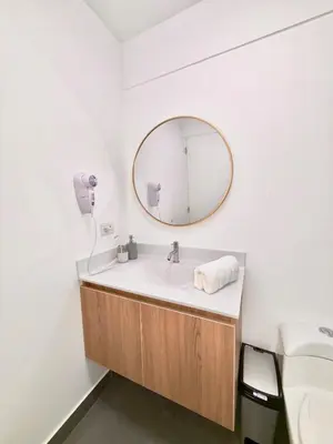 a bathroom with a sink and a mirror at Lima Central Apartment in Lima