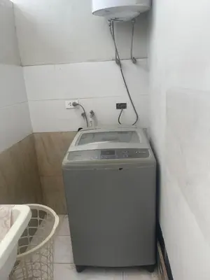 a washing machine in a bathroom with a sink at Quiet room in Lima