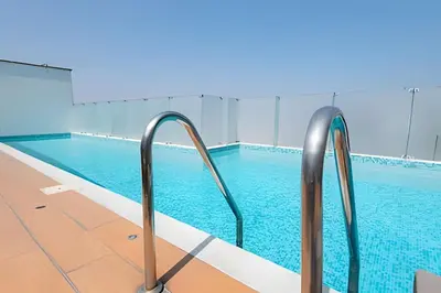 a swimming pool with metal railings in a building at Apartment in the most touristy area of Miraflores in Lima