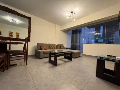 a living room with a couch and a table at Style and location in Miraflores by AG in Lima