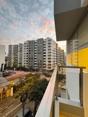 a balcony with a view of a city with buildings at Style and location in Miraflores by AG in Lima