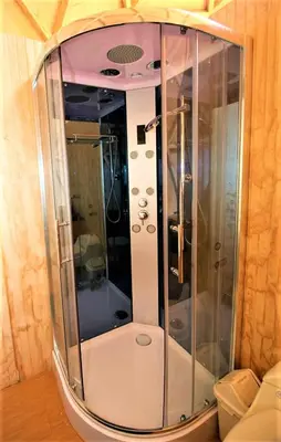 a shower with a glass enclosure in a room at Salkantay Majestic Domes Eco Lodge in Sahuayacu
