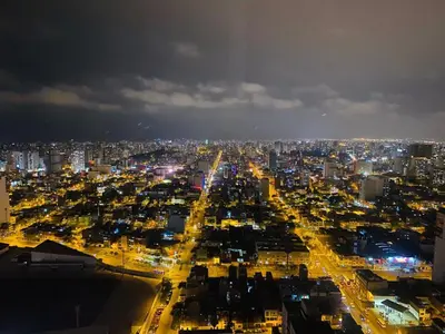 a view of a city at night with lights at VIP Apartment TORRE TEMPO in Lima