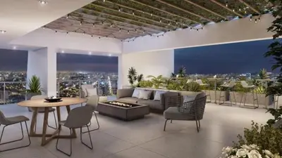 a living room with a couch and a table and chairs at VIP Apartment TORRE TEMPO in Lima