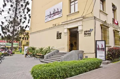 a building with stairs in front of a building at Larq'a Park Rooms in Lima