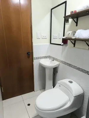 a bathroom with a toilet and a sink at Suites Tintaya in Cusco