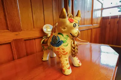 a figurine of a dog sitting on a table at HISTORIC CENTRAL Apartment in Cusco