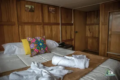 a room with a bed with towels on it at HISTORIC CENTRAL Apartment in Cusco