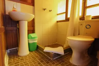 a bathroom with a toilet and a sink at HISTORIC CENTRAL Apartment in Cusco
