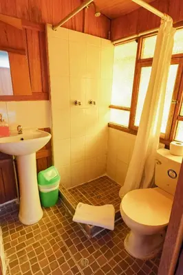 a bathroom with a toilet and a sink at HISTORIC CENTRAL Apartment in Cusco
