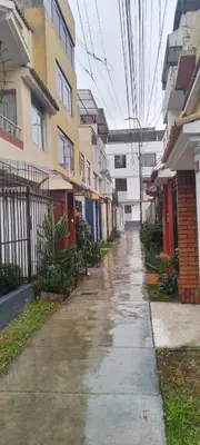 a wet sidewalk in front of some buildings at Hermoso mini dpto en San Luis Lima in Lima
