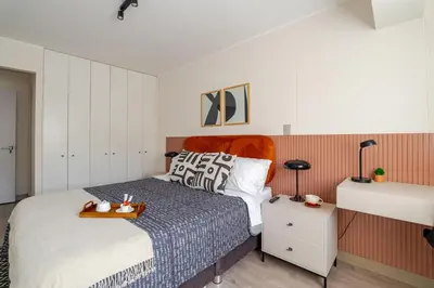 a bedroom with a bed with a tray on it at Cozy apartment by Parque Kennedy, Miraflores in Lima