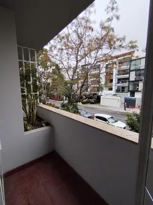 a balcony with a view of a parking lot at Spacious apartment - San Isidro in Lima