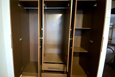 a wooden cabinet with glass doors in a room at Elegant and spacious penthouse in Lima