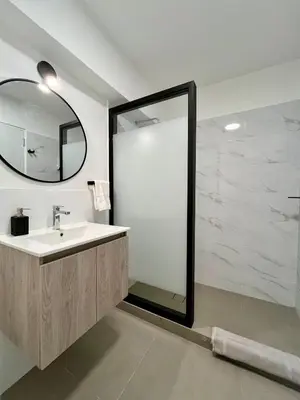 a bathroom with a sink and a mirror at Beautiful cozy apartment in Cusco
